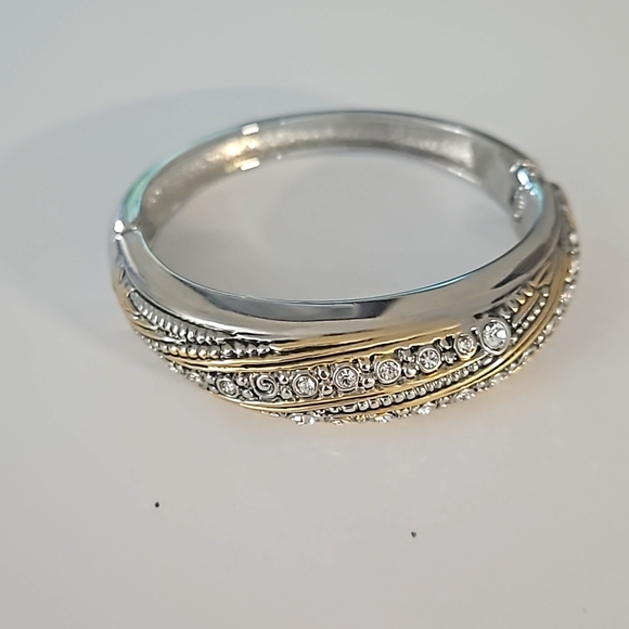 Bracelets with silver and gold tones. - Picture 1 of 4